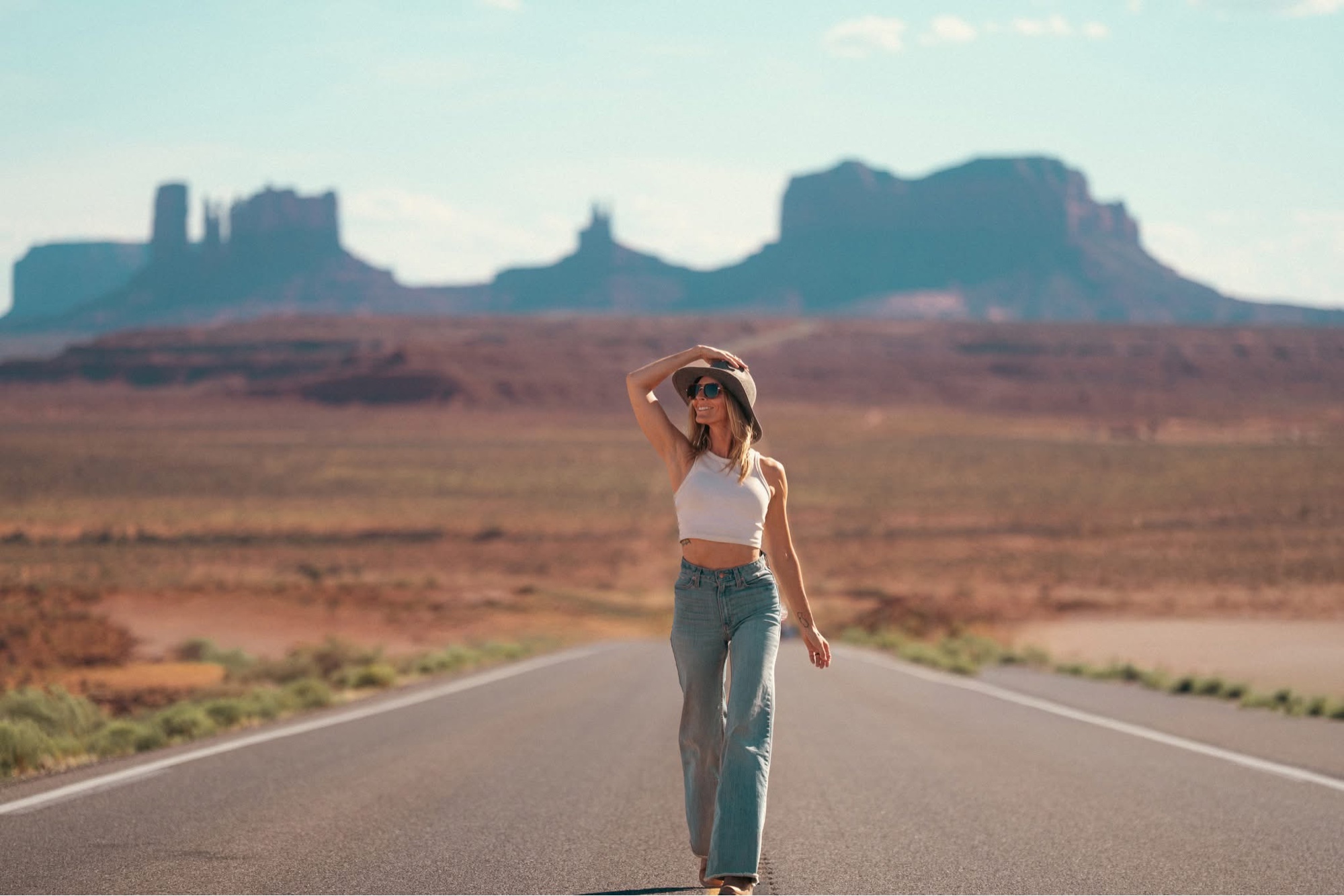 Nicole walking down a road in Monument Valley